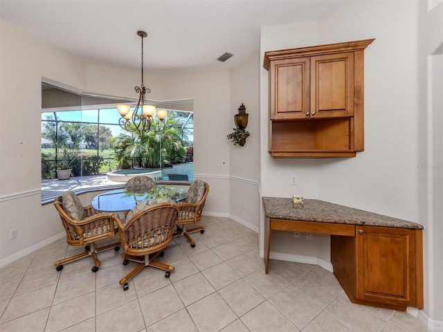 2022 Calusa Lakes Blvd, Nokomis, FL 34275 - dining room with baseboards, visible vents, light tile patterned floors, and an inviting chandelier