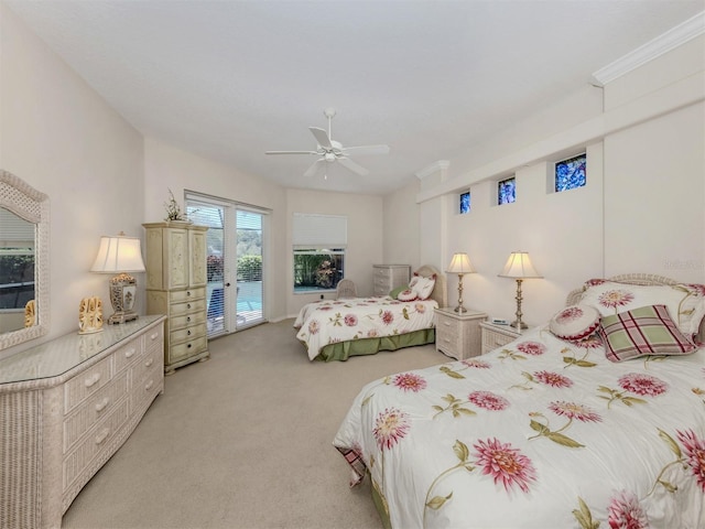 2022 Calusa Lakes Blvd, Nokomis, FL 34275 - bedroom featuring a ceiling fan, access to exterior, and light carpet