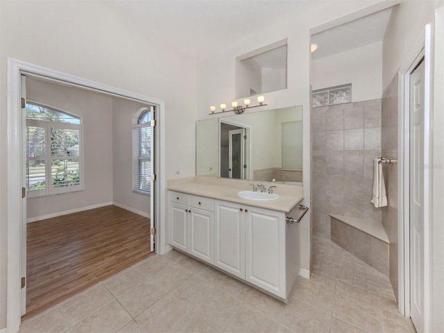 2022 Calusa Lakes Blvd, Nokomis, FL 34275 - bathroom with vanity, a walk in shower, tile patterned floors, and baseboards