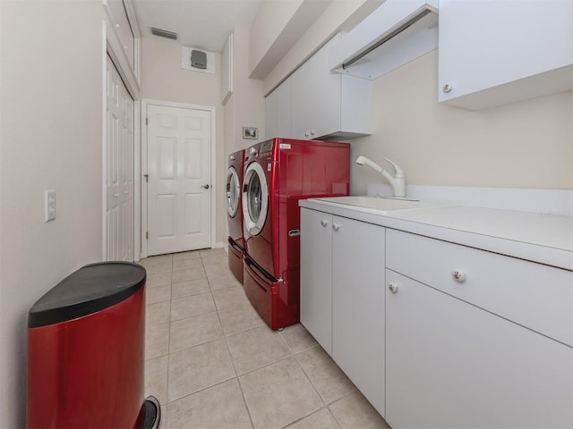 2022 Calusa Lakes Blvd, Nokomis, FL 34275 - clothes washing area featuring a sink, cabinet space, independent washer and dryer, light tile patterned floors, and visible vents