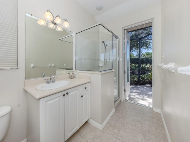 2022 Calusa Lakes Blvd, Nokomis, FL 34275 - full bath with a stall shower, baseboards, toilet, vanity, and tile patterned flooring