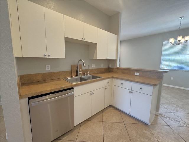 kitchen featuring a sink, a chandelier, light tile patterned flooring, dishwasher, and a peninsula