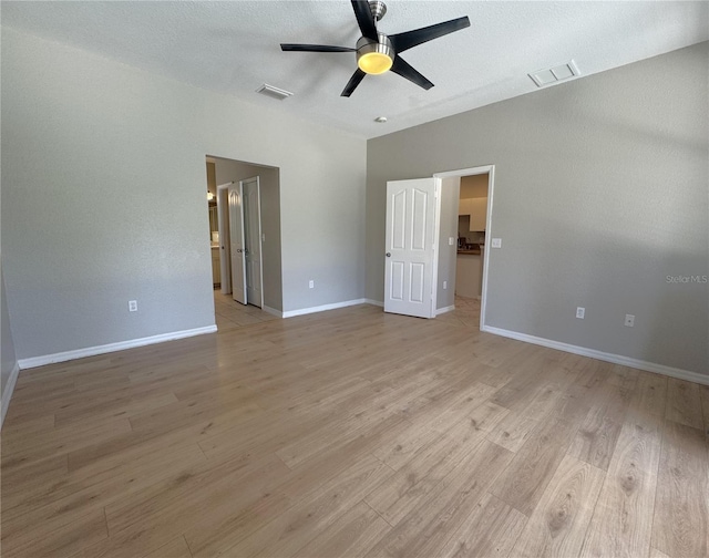 unfurnished bedroom featuring visible vents, baseboards, and light wood-type flooring