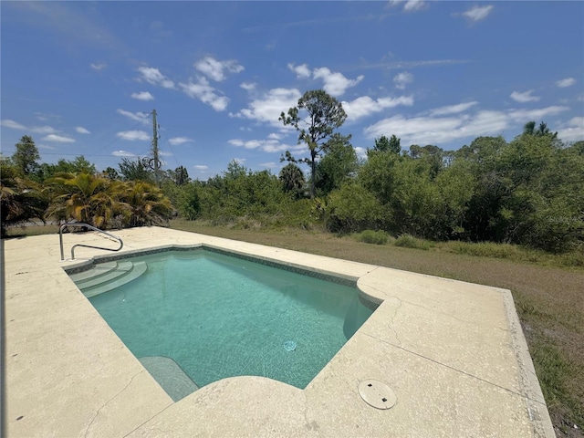 pool with a patio area