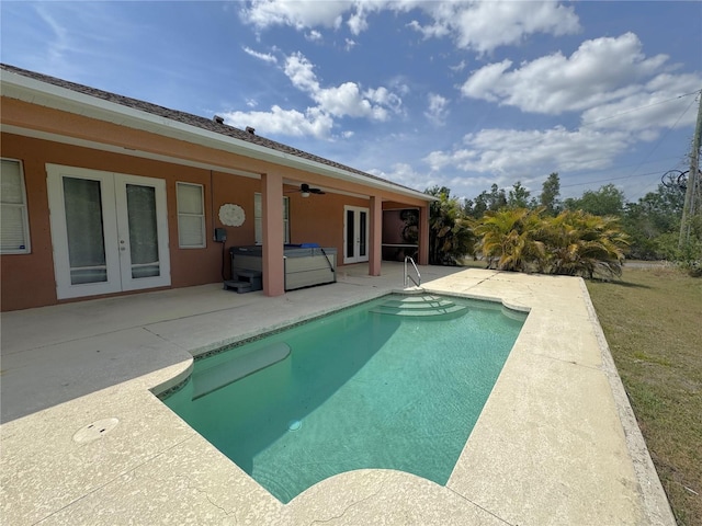 outdoor pool featuring a patio, french doors, ceiling fan, and a hot tub