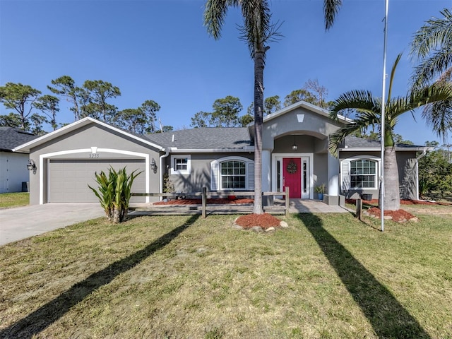 view of front of property featuring an attached garage, a front lawn, driveway, and stucco siding