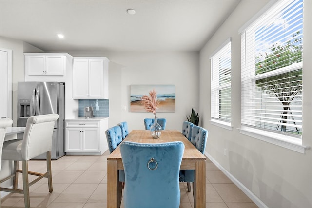 dining room featuring recessed lighting and light tile patterned flooring