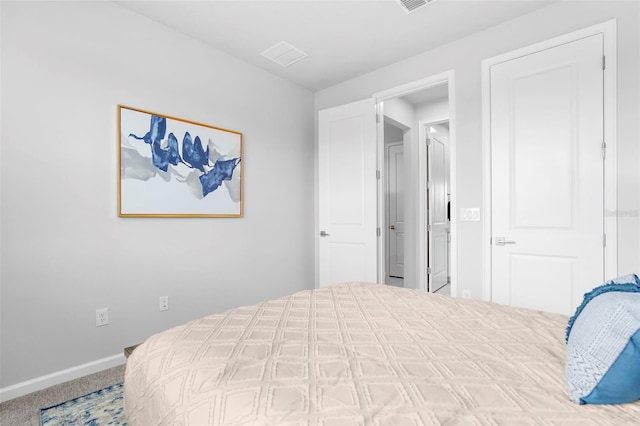 bedroom with carpet, visible vents, and baseboards