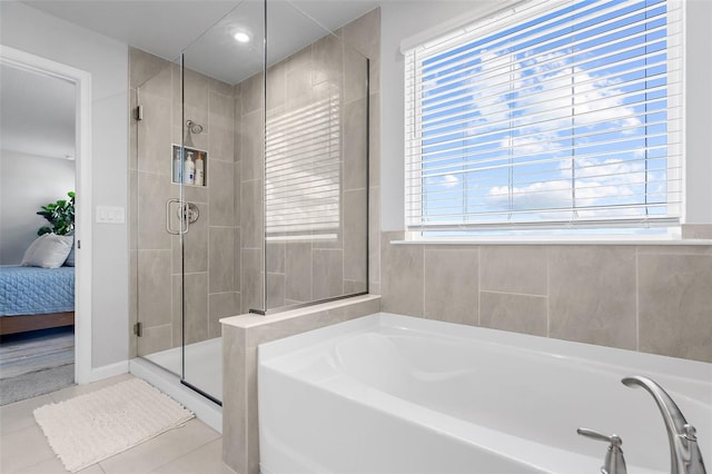 bathroom with connected bathroom, a shower stall, recessed lighting, tile patterned floors, and a garden tub