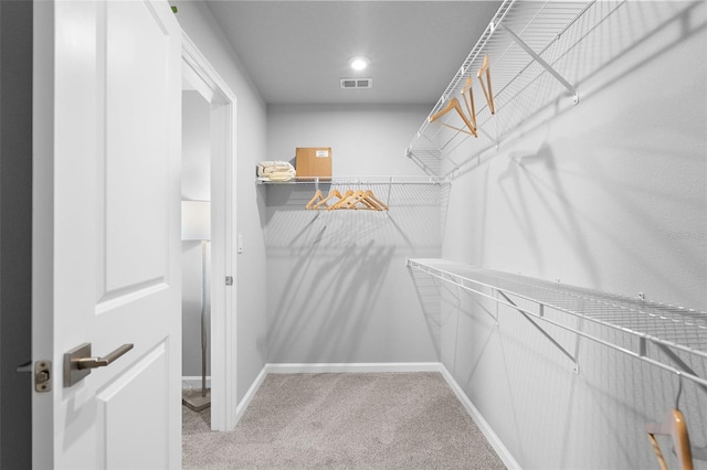 spacious closet with visible vents and carpet flooring