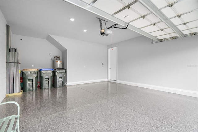 garage with recessed lighting, a garage door opener, and baseboards