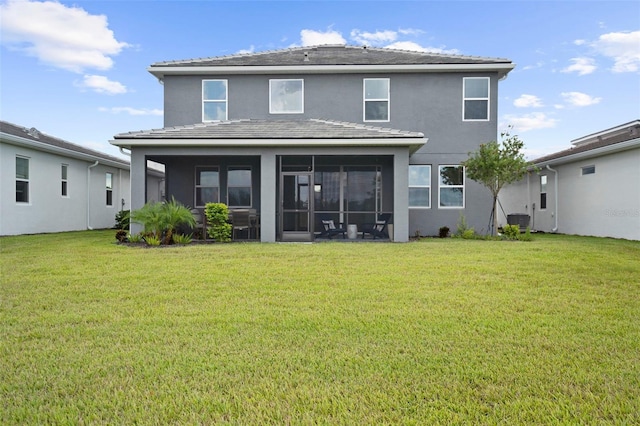 rear view of property with stucco siding, cooling unit, a lawn, and a sunroom