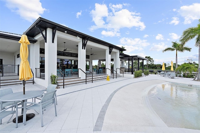 view of home's community with a patio and outdoor dining area