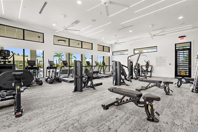 workout area featuring visible vents, ceiling fan, and plenty of natural light