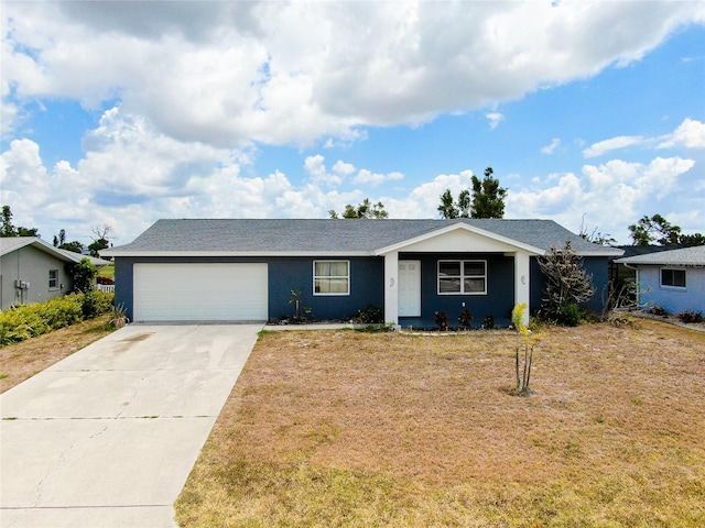 ranch-style home featuring a garage, driveway, and a front yard