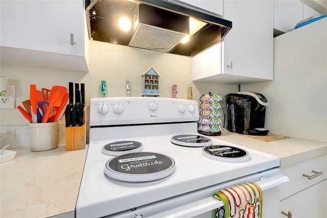 kitchen with light countertops, range hood, white electric stove, and white cabinets