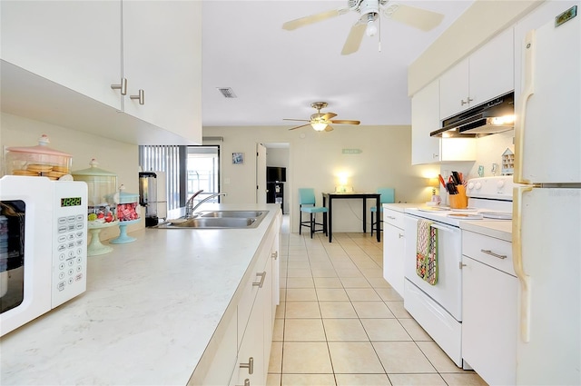kitchen with a sink, a ceiling fan, under cabinet range hood, and white appliances