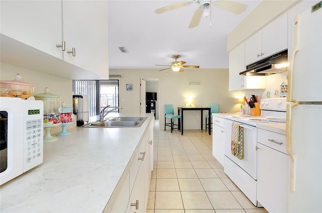 kitchen featuring a sink, ceiling fan, under cabinet range hood, and white appliances