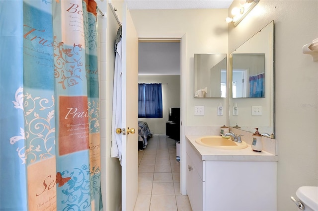 bathroom featuring tile patterned flooring, vanity, curtained shower, toilet, and connected bathroom