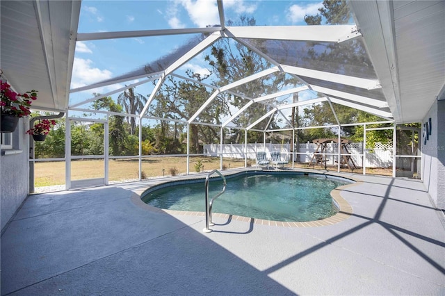 1568 Ringtail Rd, Venice, FL 34293 - view of swimming pool featuring a patio area, a fenced backyard, and a lanai