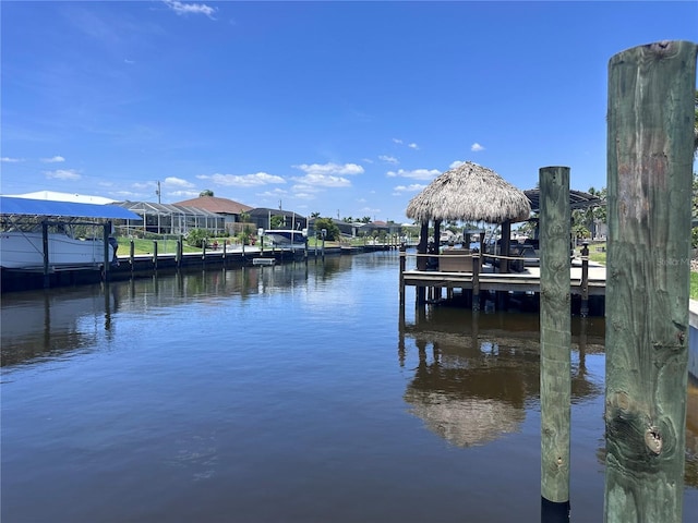 view of dock featuring a gazebo and a water view