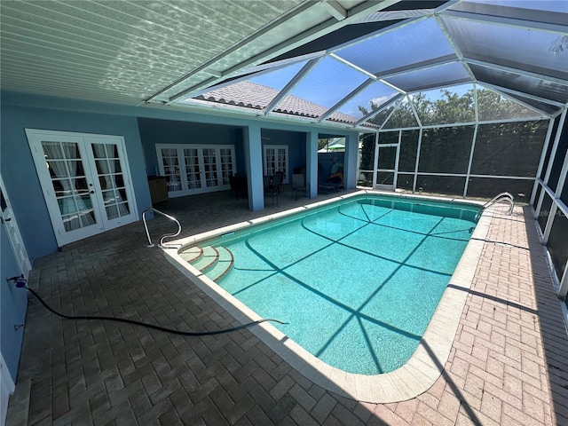 pool featuring a patio, french doors, and glass enclosure