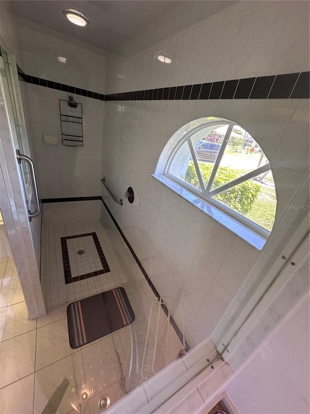 corridor with tile patterned flooring
