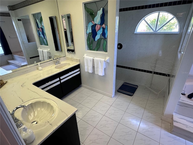 bathroom featuring walk in shower, marble finish floor, vanity, and baseboards