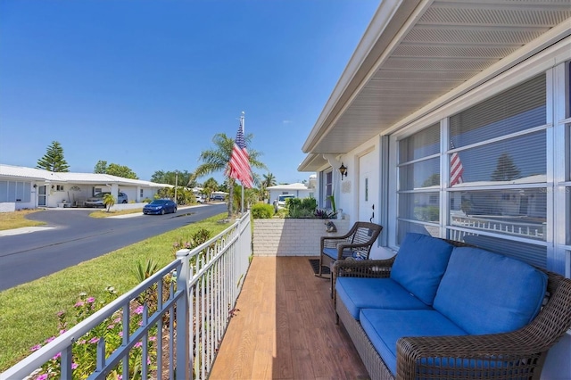 balcony featuring an outdoor hangout area and a residential view