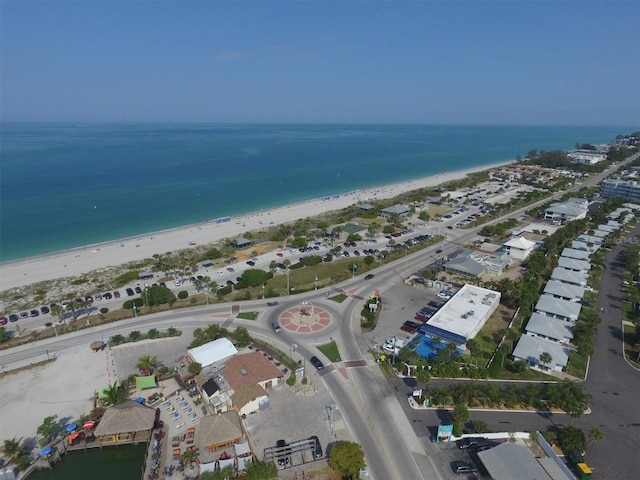 bird's eye view featuring a water view and a view of the beach