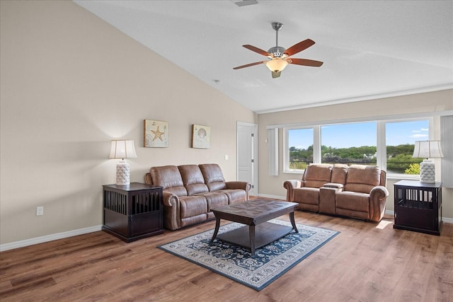 living room featuring a ceiling fan, baseboards, wood finished floors, and high vaulted ceiling