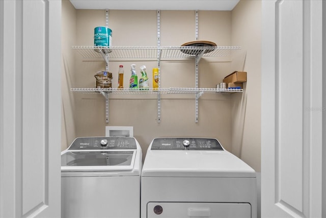 washroom featuring independent washer and dryer and laundry area