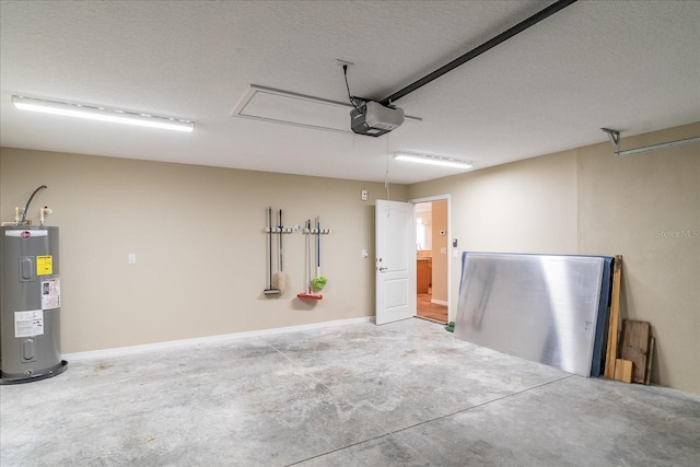 garage featuring baseboards, a garage door opener, and water heater