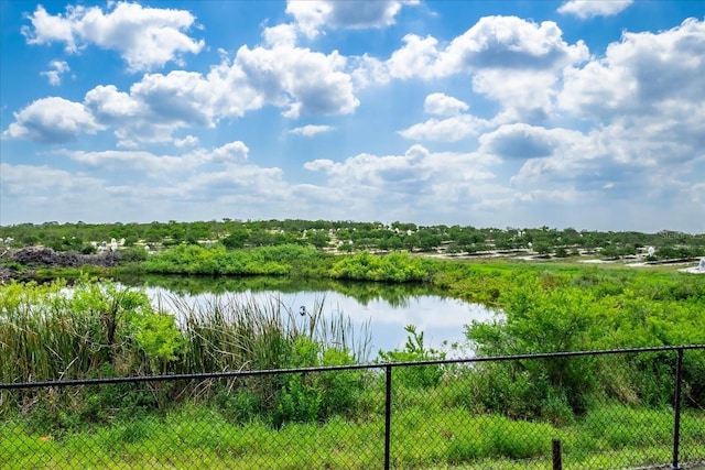 view of water feature with fence