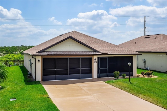 single story home with roof with shingles, driveway, and a front lawn