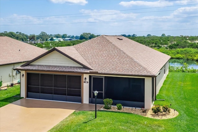ranch-style home with a garage, a shingled roof, and a front lawn