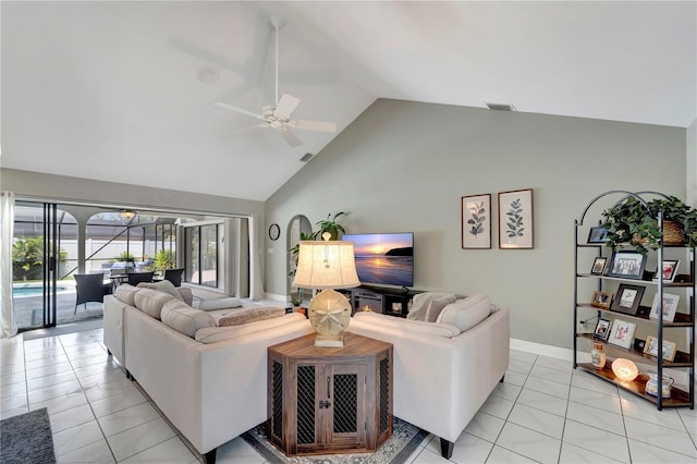 living room featuring light tile patterned floors, baseboards, visible vents, a ceiling fan, and high vaulted ceiling