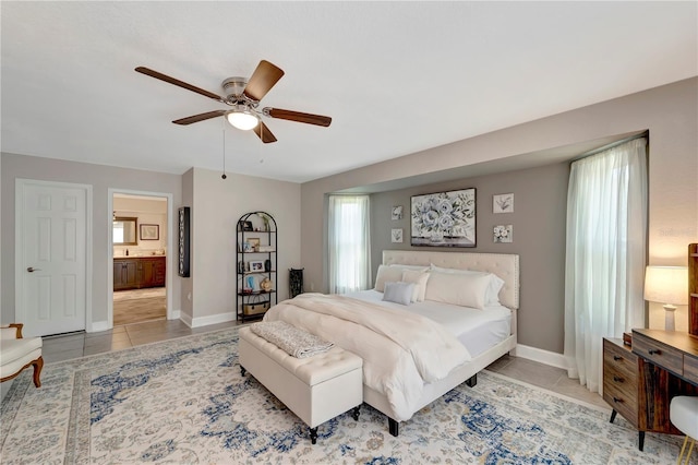 bedroom featuring tile patterned flooring, a ceiling fan, and baseboards