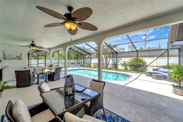 view of pool featuring an outdoor hangout area, a ceiling fan, a fenced backyard, and a patio area