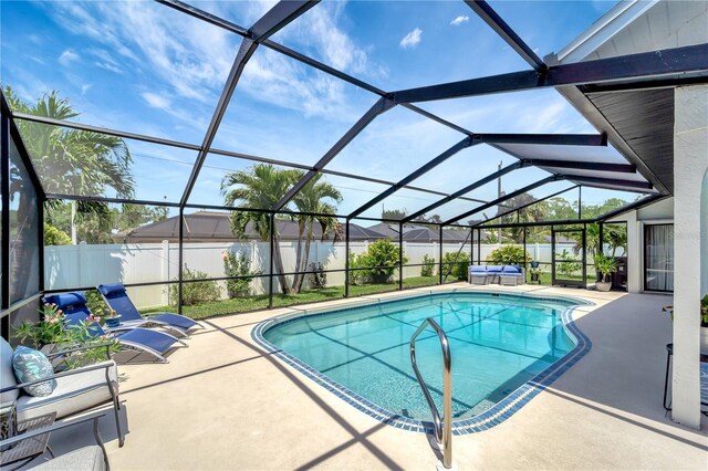 view of swimming pool with a fenced in pool, outdoor lounge area, a patio, and a fenced backyard