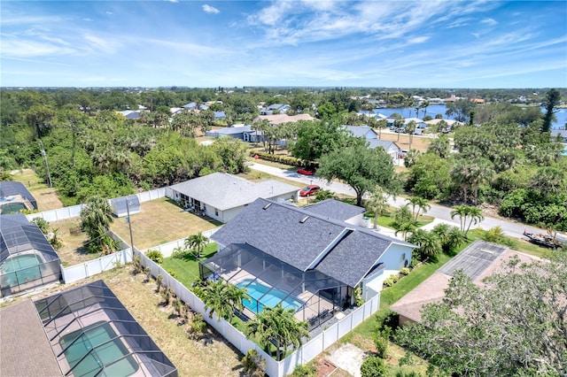 birds eye view of property with a residential view and a water view