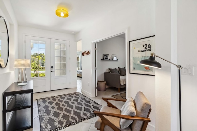 tiled foyer featuring french doors
