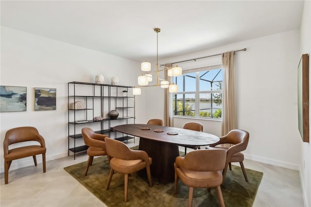 dining room with baseboards, light tile patterned flooring, and a notable chandelier