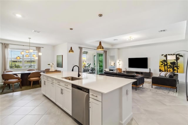 kitchen featuring a sink, dishwasher, plenty of natural light, light tile patterned floors, and visible vents