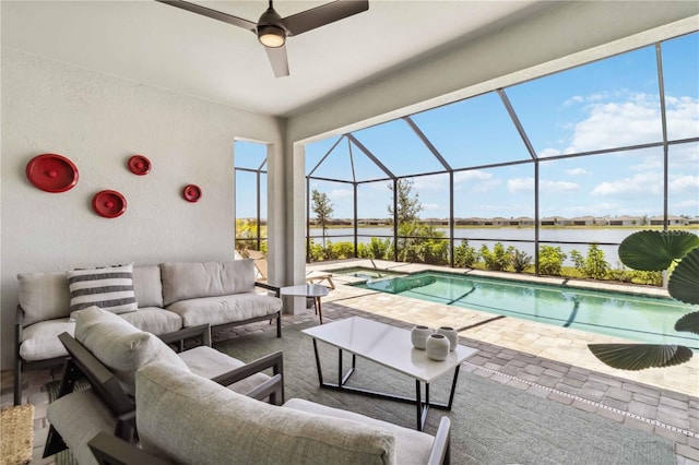pool featuring a patio, a water view, a lanai, and an outdoor hangout area