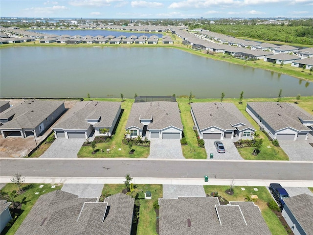 bird's eye view with a water view and a residential view