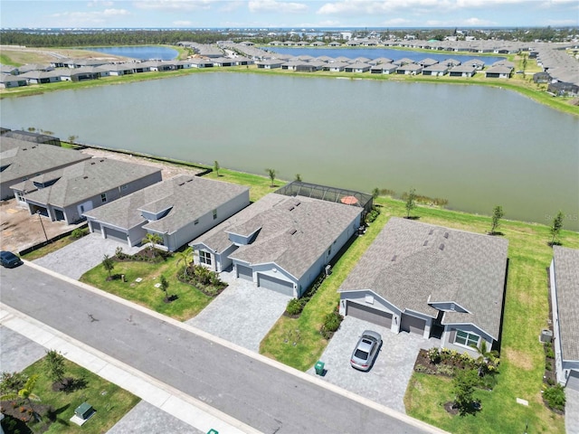 aerial view featuring a residential view and a water view