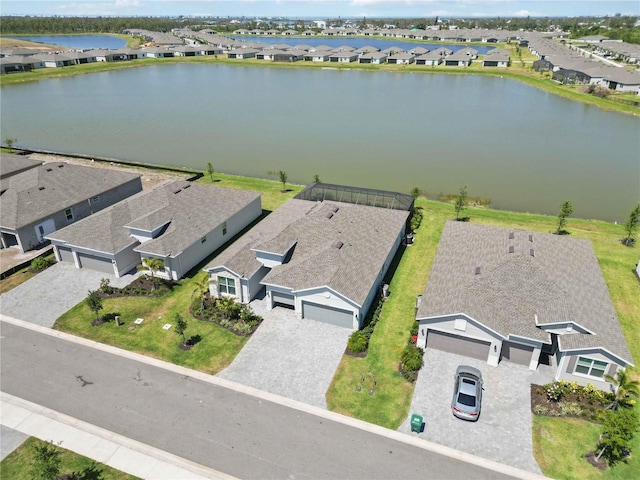 bird's eye view with a residential view and a water view