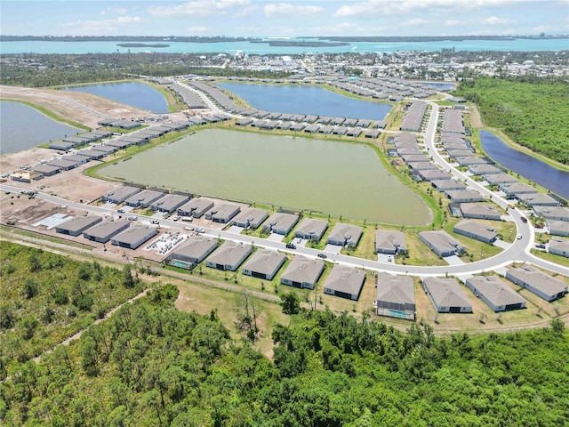 bird's eye view featuring a residential view and a water view