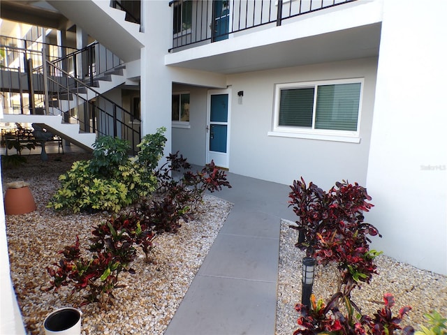 entrance to property with stucco siding